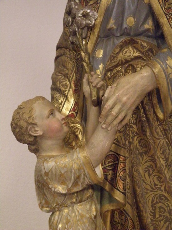 L'enfant Jésus tend à Joseph l'insigne trinitaire.